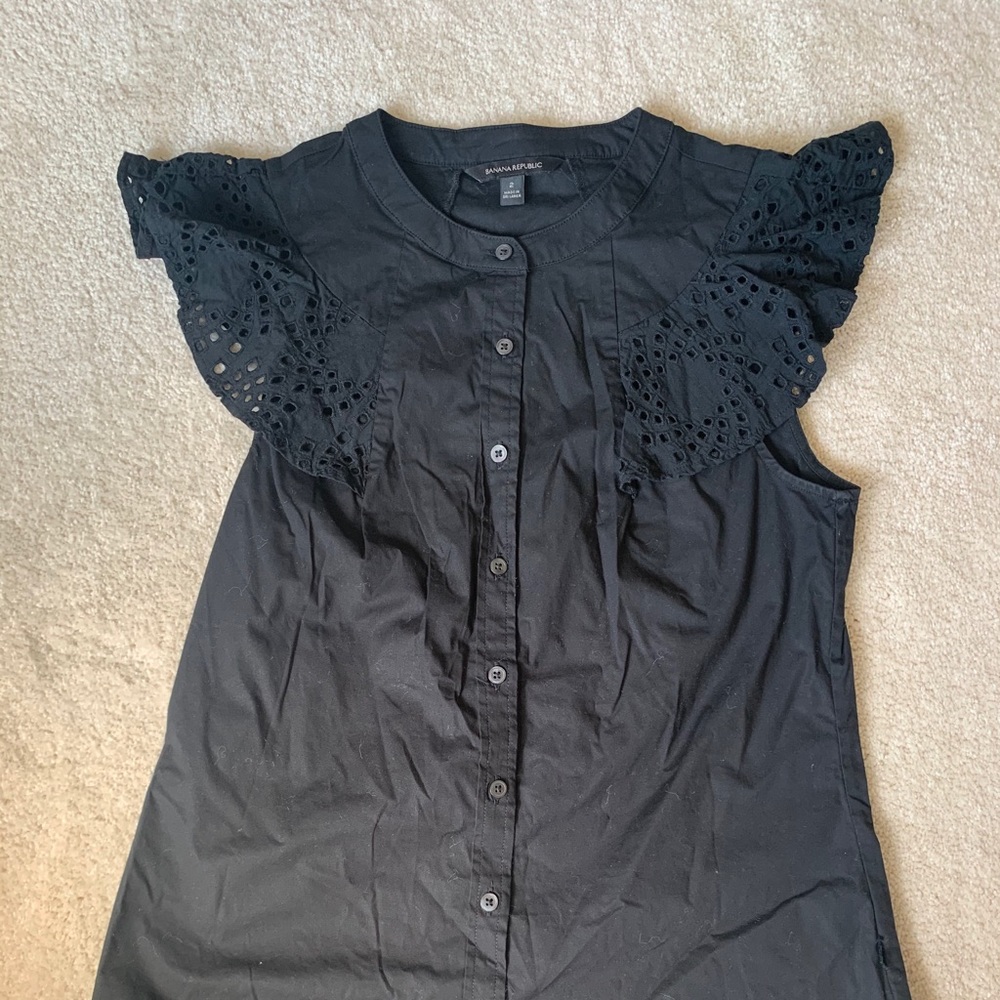 Black button down ruffle sleeveless top